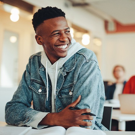 Closeup of teen smiling in classroom