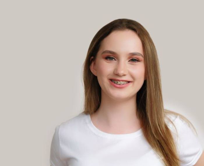 Smiling teenage girl with braces